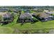 Aerial view showcases the home's screened lanai, pool, and lush landscaping in a desirable community at 12263 Lavender Loop, Bradenton, FL 34212