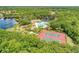 Gorgeous aerial view of the tennis courts, playground, pool and clubhouse within the community at 12263 Lavender Loop, Bradenton, FL 34212