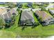 Aerial view of backyard with a screened-in lanai and well-maintained lawn at 12263 Lavender Loop, Bradenton, FL 34212