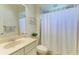 Bathroom features a vanity with decorative accents, a toilet, and shower at 12263 Lavender Loop, Bradenton, FL 34212