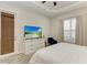 Bedroom features a white dresser, a ceiling fan, natural lighting and wood look floors at 12263 Lavender Loop, Bradenton, FL 34212