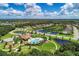 Aerial view of community featuring pool, playground, walking trails, and ponds at 12263 Lavender Loop, Bradenton, FL 34212