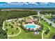 Aerial view of community pool, playground, and surrounding green spaces at 12263 Lavender Loop, Bradenton, FL 34212
