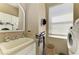 This laundry room features modern appliances, natural light, and storage solutions at 12263 Lavender Loop, Bradenton, FL 34212