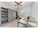 A well-lit home office offers ample space and includes built-in shelving at 12263 Lavender Loop, Bradenton, FL 34212