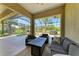 An outdoor living space includes a pool, fireplace, seating, and scenic views at 12263 Lavender Loop, Bradenton, FL 34212