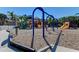 Community playground featuring colorful slides, swings, and play structures with a soft landing surface for safety at 12263 Lavender Loop, Bradenton, FL 34212