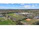 Community aerial view featuring sports fields, school and green spaces under a sunny sky at 14932 Amberjack Ter, Lakewood Ranch, FL 34202