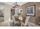 Dining space featuring a wooden table, seating for four, and an adjacent doorway at 14932 Amberjack Ter, Lakewood Ranch, FL 34202