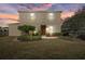 Inviting two-story home featuring a well-manicured lawn and neutral color palette at 14932 Amberjack Ter, Lakewood Ranch, FL 34202