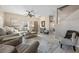 Comfortable living room featuring neutral decor, tiled floors, and staircase access at 14932 Amberjack Ter, Lakewood Ranch, FL 34202