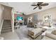 Inviting living room with neutral tones, ceiling fan, and comfortable seating arrangement at 14932 Amberjack Ter, Lakewood Ranch, FL 34202