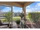 A screened patio provides a serene view of the pond at 14932 Amberjack Ter, Lakewood Ranch, FL 34202