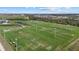 Wide aerial view of soccer fields featuring nets, lighting and clear field markings at 14932 Amberjack Ter, Lakewood Ranch, FL 34202