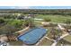 Aerial view of a roller hockey court, a playground and surrounding park area on a sunny day at 14932 Amberjack Ter, Lakewood Ranch, FL 34202