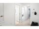 Hallway provides access to secondary rooms in this neutrally decorated home at 15105 Cuzcorro Ct, Nokomis, FL 34275