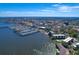 Picturesque aerial view of waterfront condos and boat docks near the city showcasing the prime location at 1600 1St W Ave # 102A, Bradenton, FL 34205
