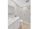 Contemporary bathroom featuring a glass shower, modern vanity, and neutral color scheme at 1600 1St W Ave # 102A, Bradenton, FL 34205