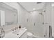 Bright bathroom featuring a glass enclosed shower with mosaic tile floor and modern vanity at 1600 1St W Ave # 102A, Bradenton, FL 34205