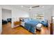 Bright bedroom with wood floors, a large window, and modern furniture at 1600 1St W Ave # 102A, Bradenton, FL 34205