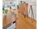 Dining area showcasing wood floors, modern furniture, and decorative storage at 1600 1St W Ave # 102A, Bradenton, FL 34205