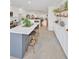 Spacious kitchen featuring a large island, stainless steel appliances, and open layout at 1600 1St W Ave # 102A, Bradenton, FL 34205