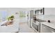 A modern kitchen with white cabinets and stainless steel appliances at 1600 1St W Ave # 102A, Bradenton, FL 34205