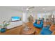 Bright living room with modern furnishings, wood floors, and access to the dining area at 1600 1St W Ave # 102A, Bradenton, FL 34205