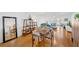 Bright open living space with hardwood floors, modern furnishings, and sliding glass doors to the outdoor space at 1600 1St W Ave # 102A, Bradenton, FL 34205