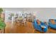 Spacious living room with modern kitchen, hardwood floors, and access to living area at 1600 1St W Ave # 102A, Bradenton, FL 34205