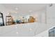 Bright living room with a kitchen island that looks into the living and dining areas at 1600 1St W Ave # 102A, Bradenton, FL 34205