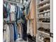Organized walk-in closet with shelving and hanging space for clothes and shoes at 1620 Boathouse Cir # 101, Sarasota, FL 34231