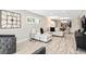 Inviting living room featuring stylish seating, a large sectional sofa, and seamless access to the dining area at 1620 Boathouse Cir # 101, Sarasota, FL 34231