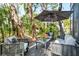 Inviting patio featuring comfortable outdoor seating and lush tropical surroundings at 1620 Boathouse Cir # 101, Sarasota, FL 34231
