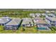 Aerial view of the back of the house with a screened-in patio surrounded by other homes at 16816 Seraphic Trl, Lakewood Ranch, FL 34211