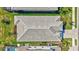 Birds eye view of the house with tile roof, patio, manicured lawn and landscaping at 16816 Seraphic Trl, Lakewood Ranch, FL 34211