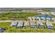 Drone shot displays property next to green space, water feature, and other homes at 16816 Seraphic Trl, Lakewood Ranch, FL 34211