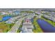 The home is in a community with ponds and manicured lawns, view from above at 16816 Seraphic Trl, Lakewood Ranch, FL 34211