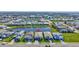 Aerial view of neighborhood showcasing the home's location near a beautiful lake at 16816 Seraphic Trl, Lakewood Ranch, FL 34211