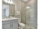 Bathroom featuring single vanity, large mirror, and stand up shower with glass door at 16816 Seraphic Trl, Lakewood Ranch, FL 34211
