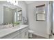 Bathroom featuring single vanity, large mirror, and shower with glass door at 16816 Seraphic Trl, Lakewood Ranch, FL 34211