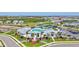 Beautiful aerial view of the community pool, clubhouse, tennis courts, playground and surrounding homes at 16816 Seraphic Trl, Lakewood Ranch, FL 34211