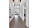 The foyer features wood floors, modern light fixture and an open floor plan at 16816 Seraphic Trl, Lakewood Ranch, FL 34211