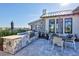Community grilling area with built-in grill, countertop, and outdoor dining space at 16816 Seraphic Trl, Lakewood Ranch, FL 34211