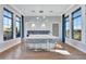 Spacious kitchen and entertainment area with a large island, modern lighting, and ample storage at 16816 Seraphic Trl, Lakewood Ranch, FL 34211