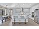 Bright kitchen with a large island, stainless steel appliances, and an adjacent dining area at 16816 Seraphic Trl, Lakewood Ranch, FL 34211