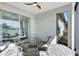 Screened patio features a table and access to the backyard at 16816 Seraphic Trl, Lakewood Ranch, FL 34211