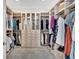 Spacious walk-in closet with custom shelving, drawers, and ample space for storage at 16816 Seraphic Trl, Lakewood Ranch, FL 34211