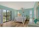 Bright bedroom with slider to balcony offering a water view at 1783 Lake Pl # 1783C, Venice, FL 34293