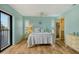 Bedroom with a walk in closet, ensuite bath and balcony access at 1783 Lake Pl # 1783C, Venice, FL 34293